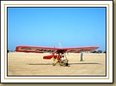 Ultralight lands and takes off on the beach in front of your home.